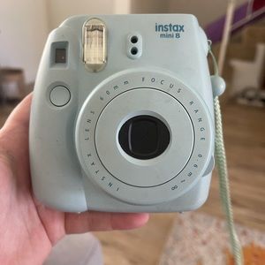 Baby blue Polaroid camera